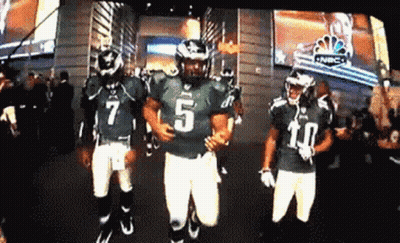 Football Player Number 5 Running With Teammates GIF