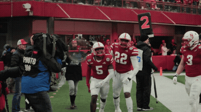 Football Player Number 5 Walking Off Field GIF