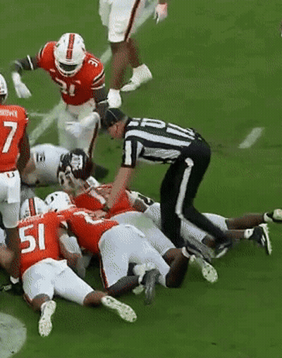 Football Player Number 51 Laying On Ground GIF