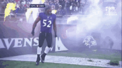 Football Player Number 52 Walking On Field GIF