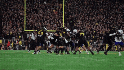 Football Player Number 53 Being Tackled GIF