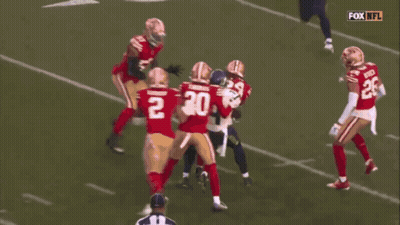 Football Player Number 54 Tackled GIF