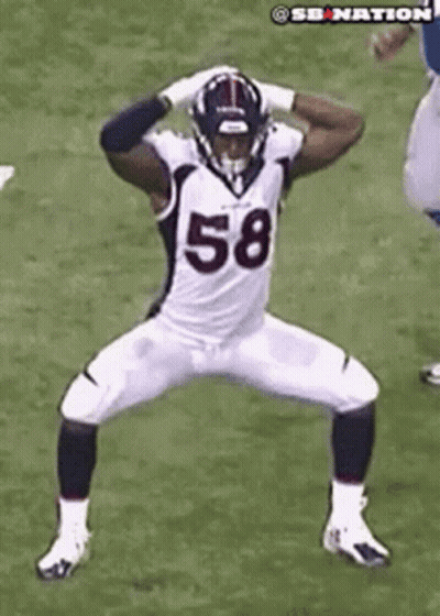 Football Player Number 58 Standing On Field GIF