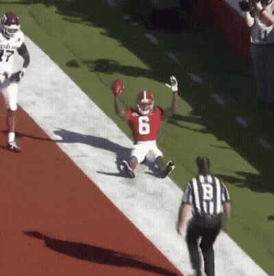 Football Player Number 6 Sliding Down Field GIF