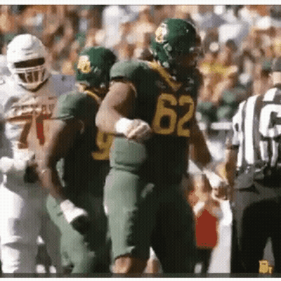 Football Player Number 62 Next To Another Player GIF