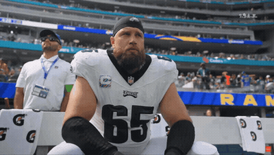 Football Player Number 65 Sitting On Bench GIF