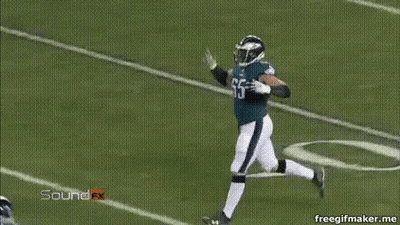 Football Player Number 65 Sitting On Bench GIF