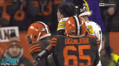 Football Player Number 65 Talking To Another GIF