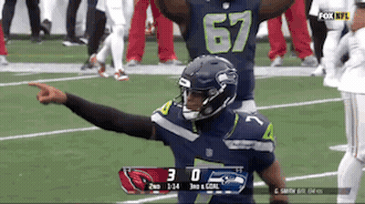 Football Player Number 67 Pointing GIF