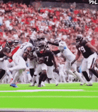 Football Player Number 7 Being Tackled GIF