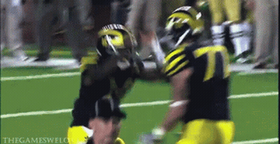 Football Player Number 7 Being Tackled GIF