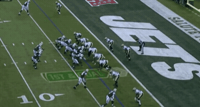 Football Player Number 7 Being Tackled GIF
