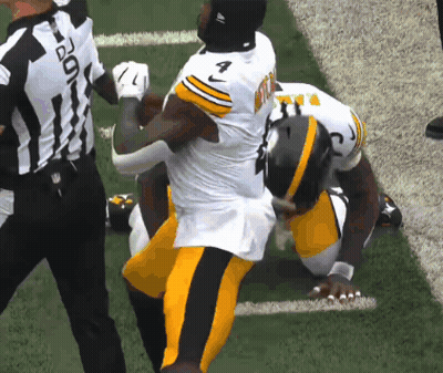 Football Player Number 7 Being Tackled GIF