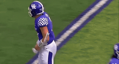 Football Player Number 7 Standing Next To Another GIF