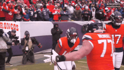 Football Player Number 77 Hugged By Another Player GIF