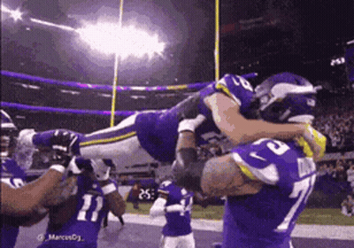 Football Player Number 77 Lifted In Air GIF