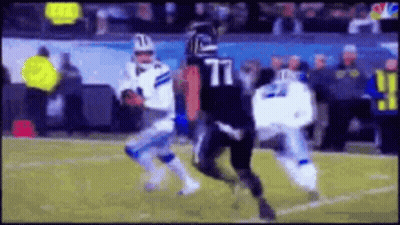 Football Player Number 77 Tackled GIF