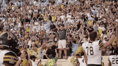 Football Player Number 78 Jersey In Front Of Crowd GIF