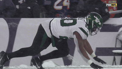 Football Player Number 8 Running In Snow GIF