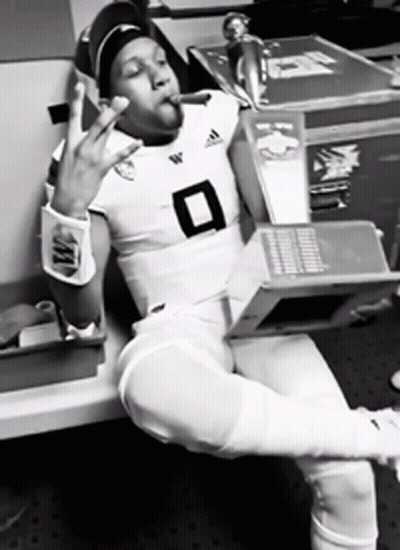 Football Player Number 8 Smoking Cigarette Holding Laptop GIF