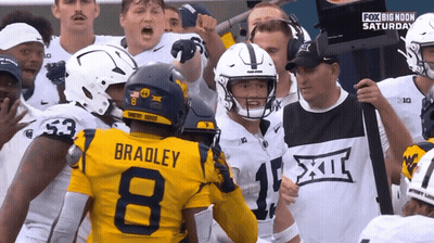 Football Player Number 8 Surrounded By Players GIF