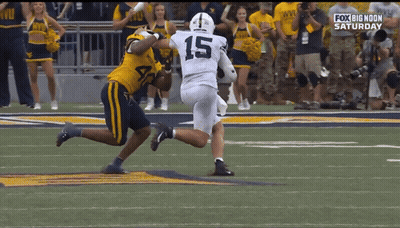Football Player Number 8 Surrounded By Players GIF