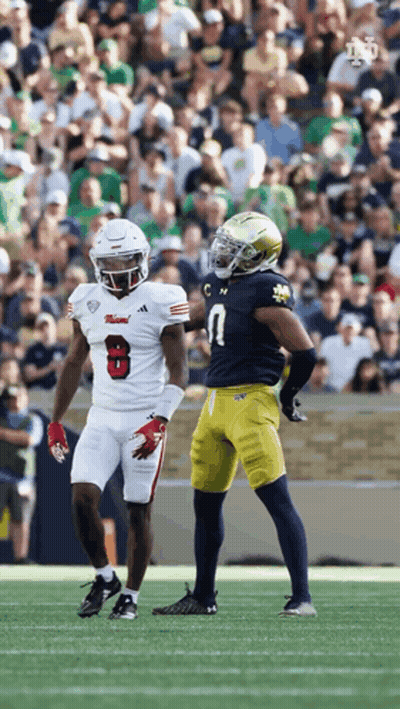Football Player Number 8 Talking To Another Player GIF