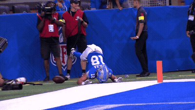 Football Player Number 81 Laying on Field