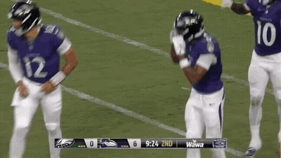 Football Player Number 81 Surrounded By Players GIF
