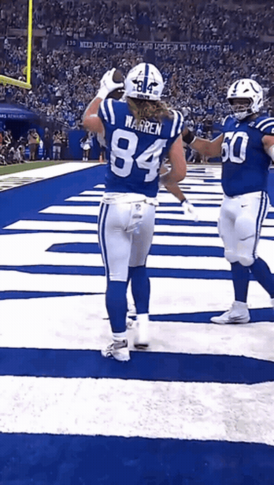 Football Player Number 84 Congratulated By Teammate GIF
