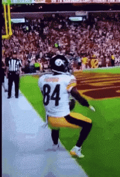 Football Player Number 84 Kneeling On Field GIF
