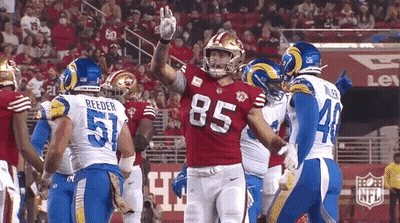Football Player Number 85 Congratulated By Teammates GIF
