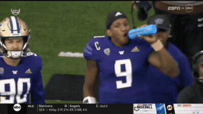 Football Player Number 9 Drinking From Blue Bottle GIF