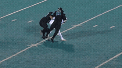 Football Player Number 94 Being Tackled GIF