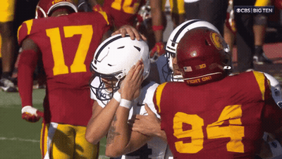 Football Player Number 94 Hugging Another Player GIF