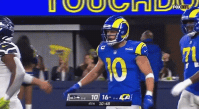 Football Player Number 94 Running On Field GIF