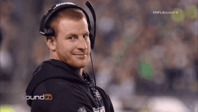 Football Player Number 95 Helmet Stands In Front Of Camera GIF