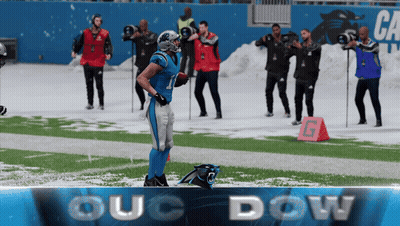 Football Player On Field With OUC Dow Banner GIF