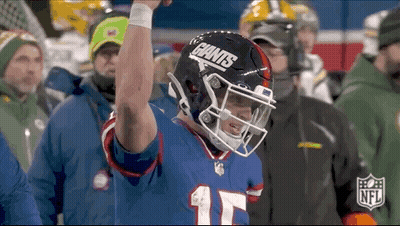 Football Player Raising Arm With Giants Helmet GIF