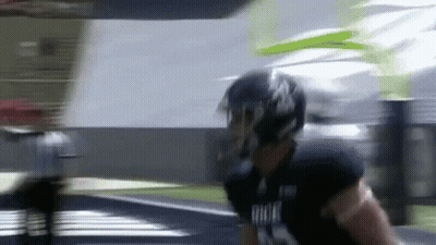 Football Player Running In Helmet And Gloves GIF
