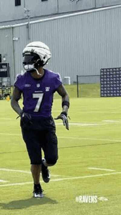 Football Player Running In Purple Jersey And Helmet GIF