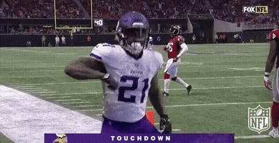 Football Player Running On Field In Purple Jersey Number 21 GIF