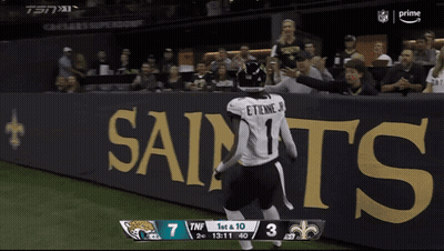 Football Player Running On Field With Scoreboard Saying TNF GIF