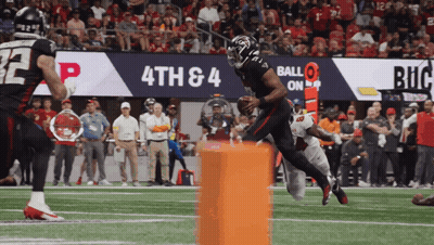 Football Player Running With Ball Before 4Th And 4 Sign GIF