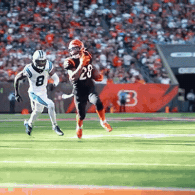 Football Player Running With Ball Being Chased GIF