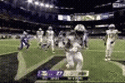 Football Player Running With Ball In Stadium GIF