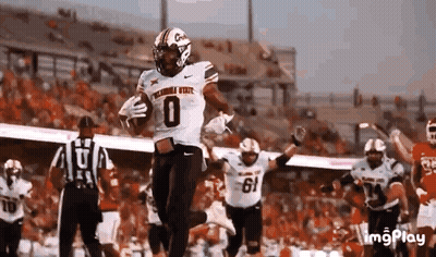 Football Player Running With Ball While Others Celebrate GIF