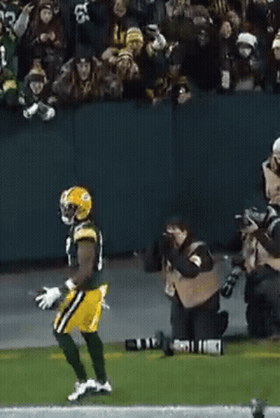 Football Player Running With Cameraman GIF