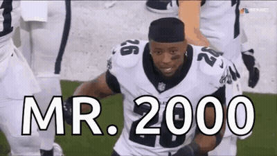 Football Player Running With Mr. 2000 GIF