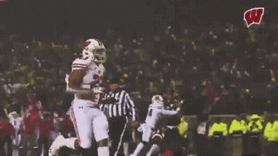 Football Player Running With W Logo In Background GIF